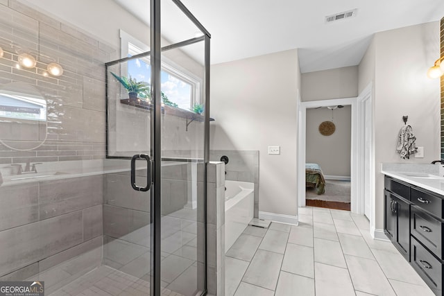 19 E Murphy St, Newnan, GA 30263 - full bath featuring vanity, a garden tub, connected bathroom, and plenty of natural light