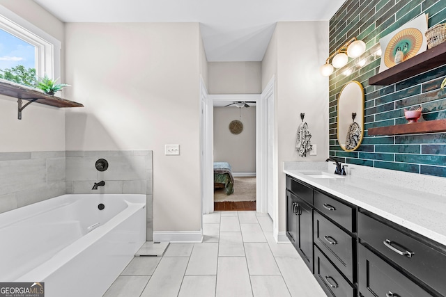 19 E Murphy St, Newnan, GA 30263 - ensuite bathroom with vanity, a bath, baseboards, and tile patterned flooring