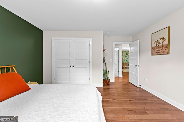 19 E Murphy St, Newnan, GA 30263 - bedroom featuring wood finished floors, baseboards, and a closet