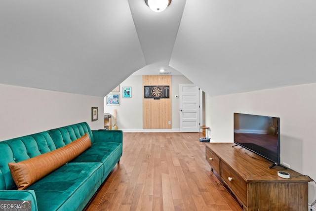 19 E Murphy St, Newnan, GA 30263 - living room featuring light wood-type flooring, lofted ceiling, and baseboards