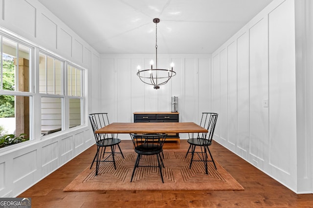 19 E Murphy St, Newnan, GA 30263 - dining space featuring a decorative wall, wood finished floors, and a chandelier