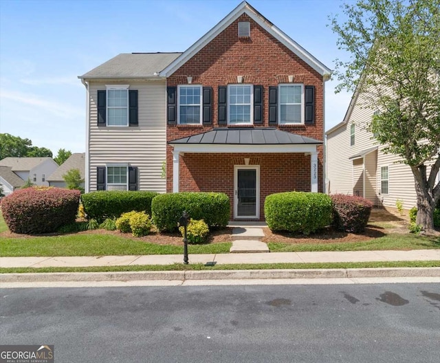 3223 Tallon Ln SW, Atlanta, GA 30311 - traditional home featuring brick siding and a standing seam roof