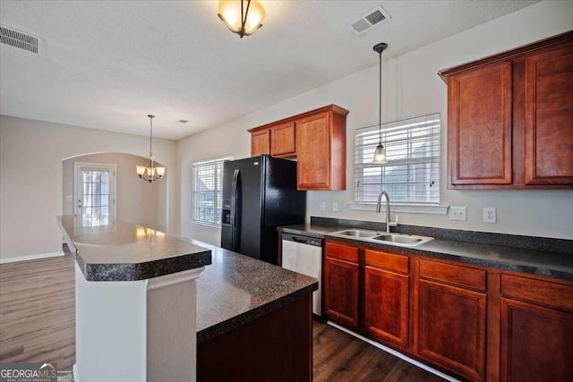 3223 Tallon Ln SW, Atlanta, GA 30311 - kitchen with a sink, black fridge, dishwasher, dark wood-style flooring, and dark countertops