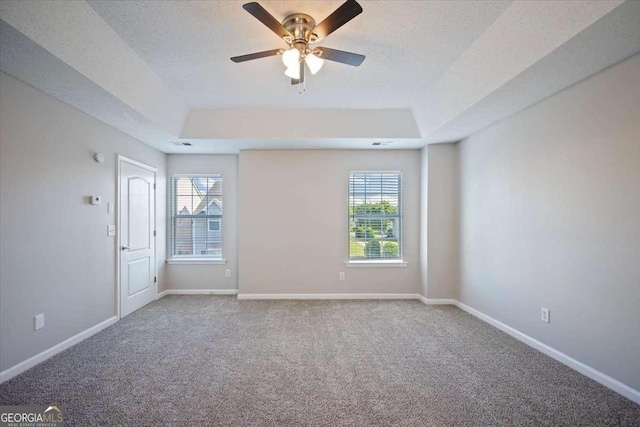 3223 Tallon Ln SW, Atlanta, GA 30311 - carpeted spare room featuring a raised ceiling, ceiling fan, and baseboards