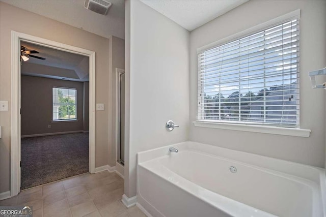 3223 Tallon Ln SW, Atlanta, GA 30311 - full bathroom featuring a bath, baseboards, a stall shower, a ceiling fan, and tile patterned flooring