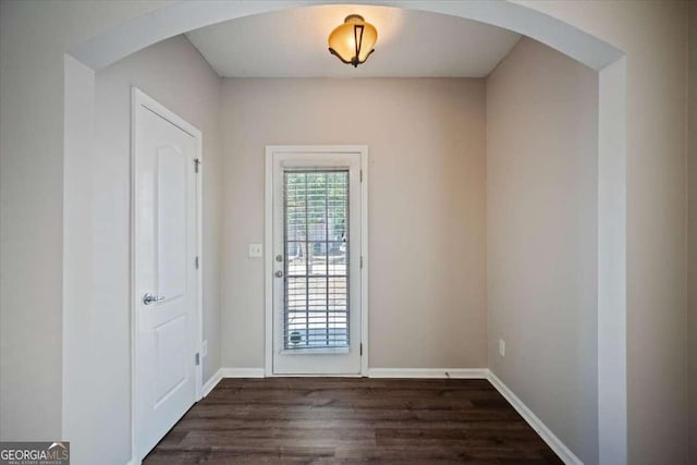 3223 Tallon Ln SW, Atlanta, GA 30311 - entryway featuring dark wood-type flooring, arched walkways, and baseboards