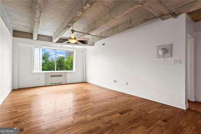 2479 Peachtree Rd NE Unit 305, Atlanta, GA 30305 - unfurnished room with radiator heating unit, a ceiling fan, and hardwood / wood-style floors
