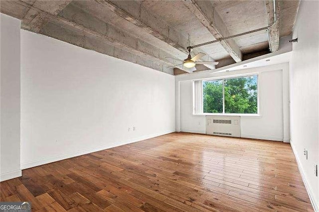 2479 Peachtree Rd NE Unit 305, Atlanta, GA 30305 - spare room with radiator heating unit, ceiling fan, and hardwood / wood-style flooring
