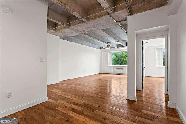 2479 Peachtree Rd NE Unit 305, Atlanta, GA 30305 - unfurnished room featuring wood finished floors and radiator heating unit