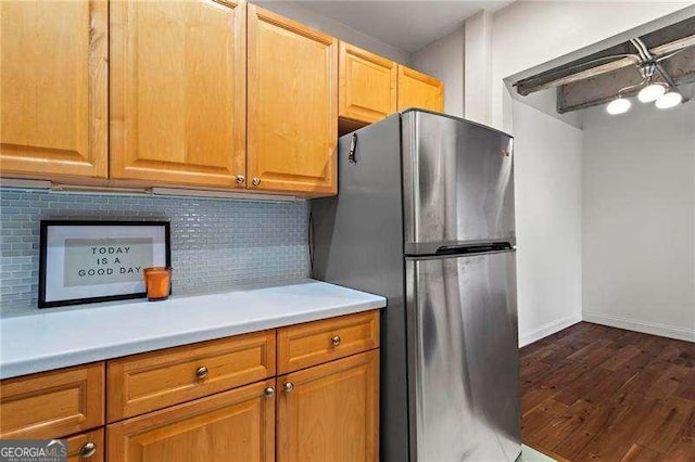 2479 Peachtree Rd NE Unit 305, Atlanta, GA 30305 - kitchen featuring freestanding refrigerator, dark wood-style flooring, backsplash, light countertops, and brown cabinetry
