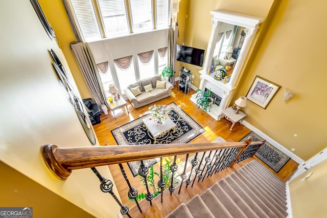 1214 Greenridge Ln, Lithonia, GA 30058 - staircase with a high ceiling and wood finished floors
