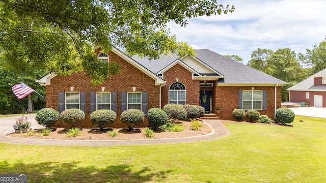 475 Harbour Shores Dr, Jackson, GA 30233 - view of front of home featuring a front lawn, brick siding, and roof with shingles