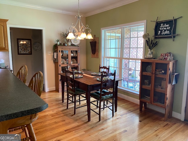475 Harbour Shores Dr, Jackson, GA 30233 - dining room with light wood finished floors, a chandelier, crown molding, and baseboards