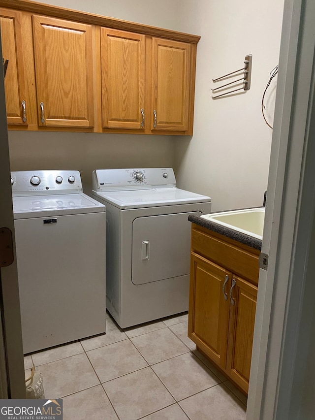 475 Harbour Shores Dr, Jackson, GA 30233 - washroom with cabinet space, washer and dryer, and light tile patterned floors
