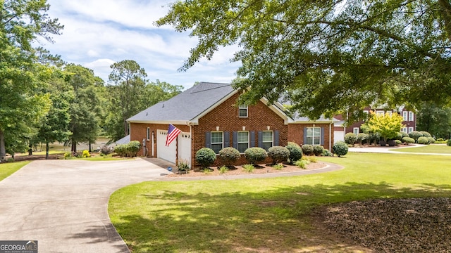 475 Harbour Shores Dr, Jackson, GA 30233 - view of front of house featuring driveway, brick siding, a front yard, and an attached garage