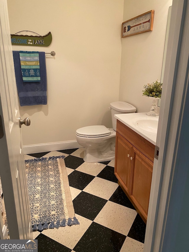 475 Harbour Shores Dr, Jackson, GA 30233 - half bathroom featuring tile patterned floors, vanity, toilet, and baseboards