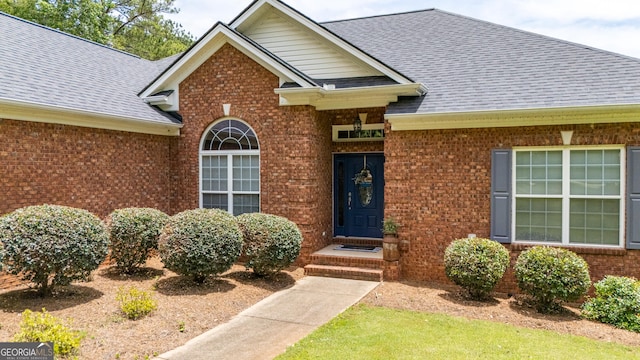 475 Harbour Shores Dr, Jackson, GA 30233 - view of exterior entry featuring brick siding and roof with shingles
