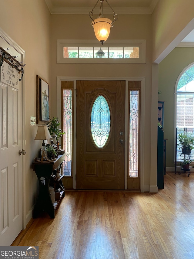 475 Harbour Shores Dr, Jackson, GA 30233 - foyer featuring light wood-style flooring, baseboards, ornamental molding, and a high ceiling