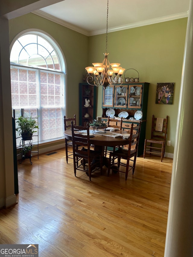 475 Harbour Shores Dr, Jackson, GA 30233 - dining space featuring a chandelier, crown molding, light wood-type flooring, and baseboards