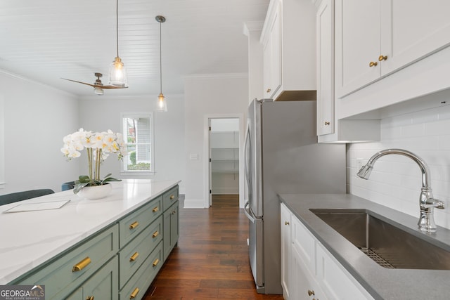 435 New St, Macon, GA 31201 - kitchen featuring green cabinetry, a sink, white cabinetry, ornamental molding, and dark wood-style floors