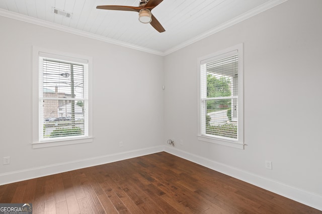 435 New St, Macon, GA 31201 - spare room featuring healthy amount of natural light, baseboards, crown molding, and dark wood-style flooring