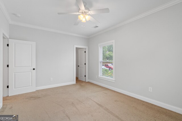 435 New St, Macon, GA 31201 - empty room featuring ceiling fan, baseboards, ornamental molding, carpet flooring, and a smoke detector