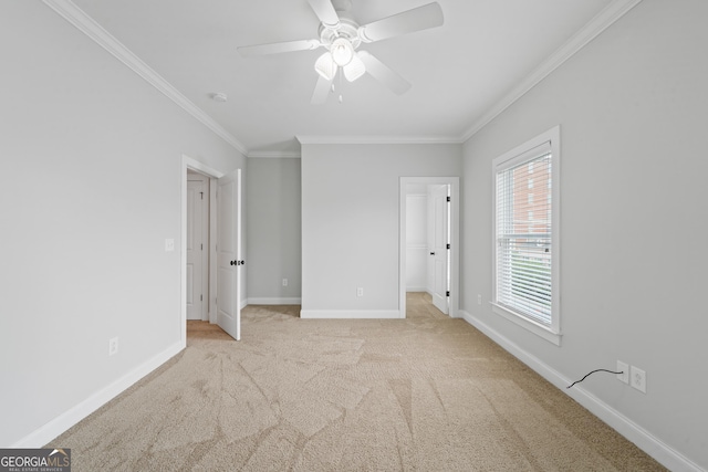 435 New St, Macon, GA 31201 - unfurnished bedroom with crown molding, carpet flooring, baseboards, a spacious closet, and ceiling fan