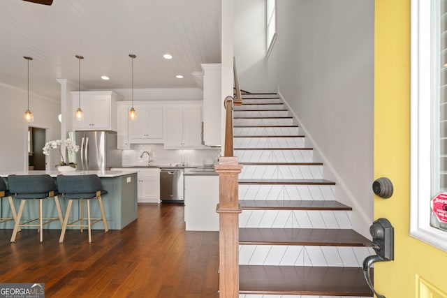 435 New St, Macon, GA 31201 - staircase featuring hardwood / wood-style floors, crown molding, and recessed lighting