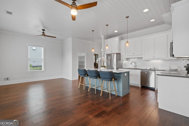 435 New St, Macon, GA 31201 - kitchen with appliances with stainless steel finishes, a ceiling fan, a sink, a center island, and dark wood-style floors