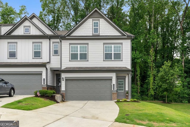 153 Witter Way, Woodstock, GA 30188 - view of front of property with a garage, a front yard, driveway, and board and batten siding
