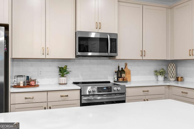 153 Witter Way, Woodstock, GA 30188 - kitchen featuring appliances with stainless steel finishes, light countertops, and tasteful backsplash