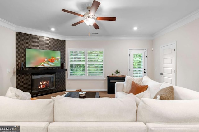 153 Witter Way, Woodstock, GA 30188 - living room with ornamental molding, ceiling fan, recessed lighting, a large fireplace, and wood finished floors