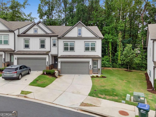 153 Witter Way, Woodstock, GA 30188 - view of front of property with an attached garage, driveway, a front yard, brick siding, and a shingled roof