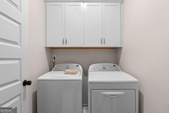 153 Witter Way, Woodstock, GA 30188 - laundry area featuring independent washer and dryer and cabinet space