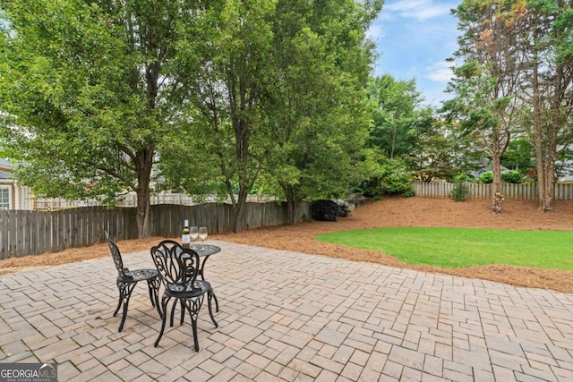 6695 Buckingham Cir, Cumming, GA 30040 - fenced backyard featuring a patio
