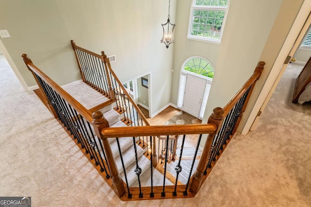 6695 Buckingham Cir, Cumming, GA 30040 - foyer featuring carpet flooring and a high ceiling