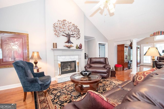 215 Fairway Ct, Newnan, GA 30265 - living room with decorative columns, ceiling fan, wood finished floors, high vaulted ceiling, and a premium fireplace