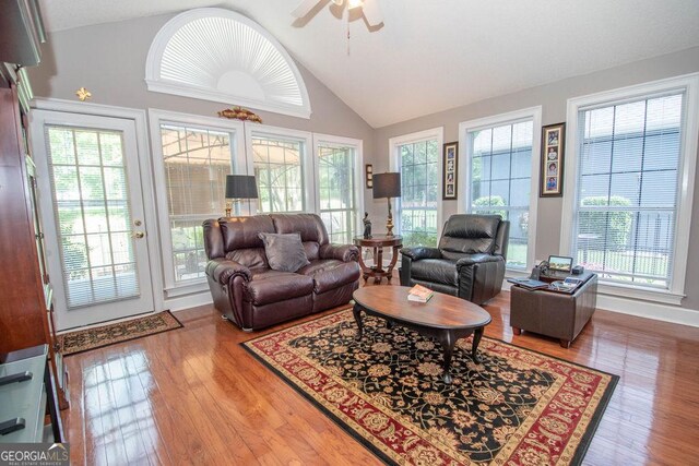 215 Fairway Ct, Newnan, GA 30265 - living area with vaulted ceiling, a ceiling fan, and wood finished floors