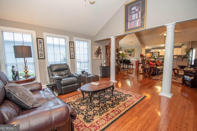 215 Fairway Ct, Newnan, GA 30265 - living area with decorative columns, wood finished floors, high vaulted ceiling, and ceiling fan