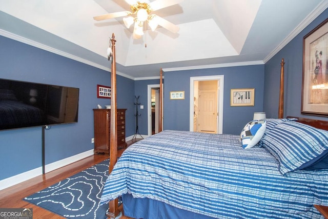 215 Fairway Ct, Newnan, GA 30265 - bedroom featuring wood finished floors, crown molding, a raised ceiling, ceiling fan, and baseboards