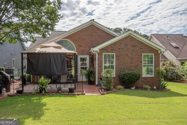 215 Fairway Ct, Newnan, GA 30265 - back of property with a patio, brick siding, and a gazebo