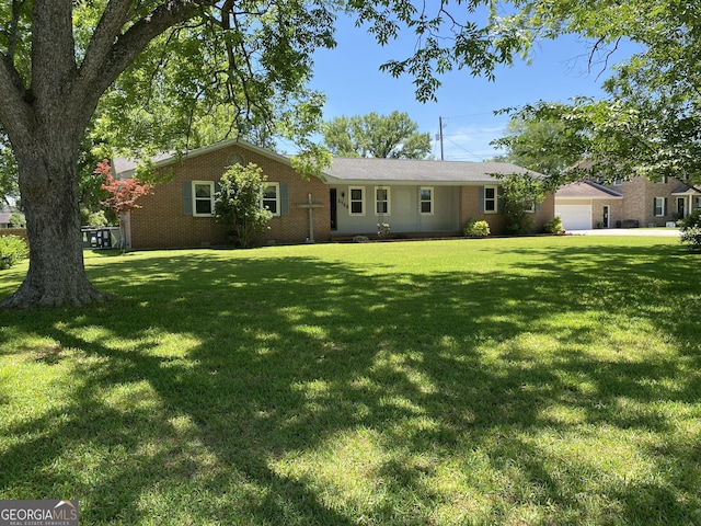 3788 Hartley Bridge Rd, Macon, GA 31216 - ranch-style house with a front lawn and brick siding