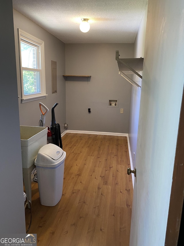 3788 Hartley Bridge Rd, Macon, GA 31216 - washroom with wood finished floors, washer hookup, electric dryer hookup, a textured ceiling, and electric panel
