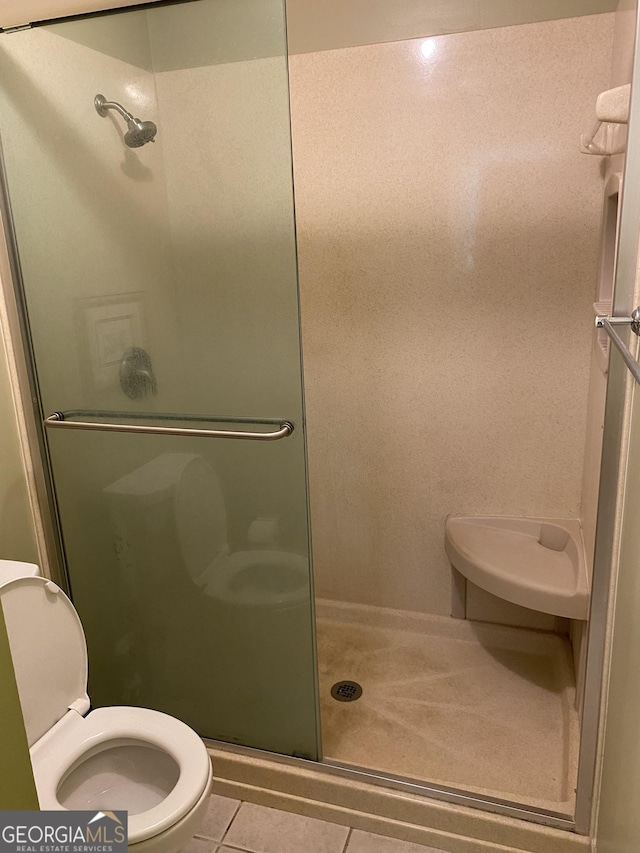 3788 Hartley Bridge Rd, Macon, GA 31216 - full bathroom featuring a shower stall and tile patterned flooring