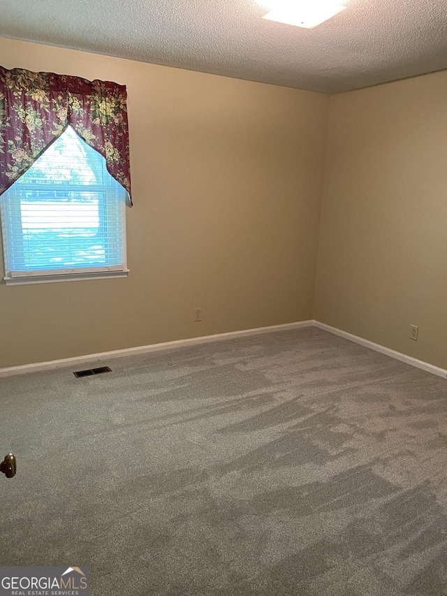 3788 Hartley Bridge Rd, Macon, GA 31216 - unfurnished room featuring carpet flooring