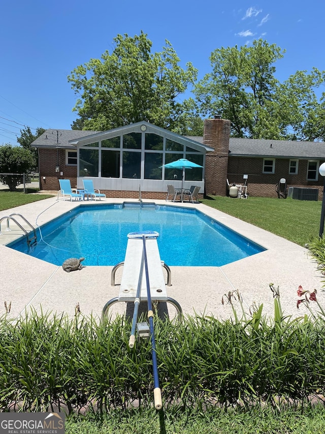 3788 Hartley Bridge Rd, Macon, GA 31216 - swimming pool featuring a patio area, a sunroom, and a diving board