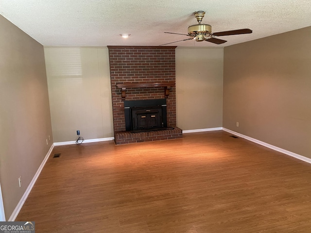 3788 Hartley Bridge Rd, Macon, GA 31216 - unfurnished living room with ceiling fan, wood finished floors, and a textured ceiling