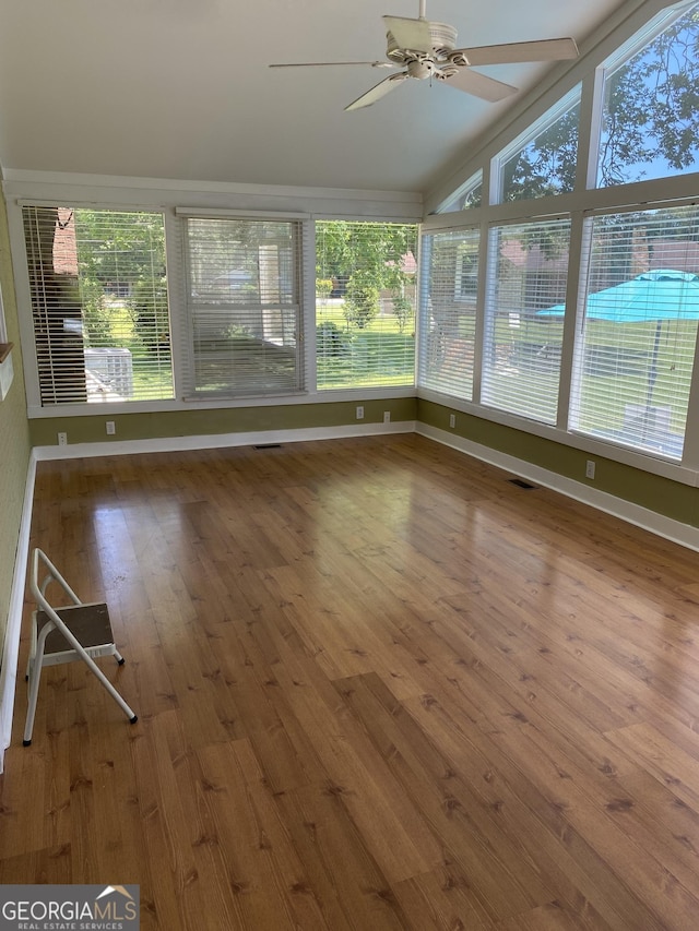 3788 Hartley Bridge Rd, Macon, GA 31216 - unfurnished sunroom featuring lofted ceiling and wood-type flooring