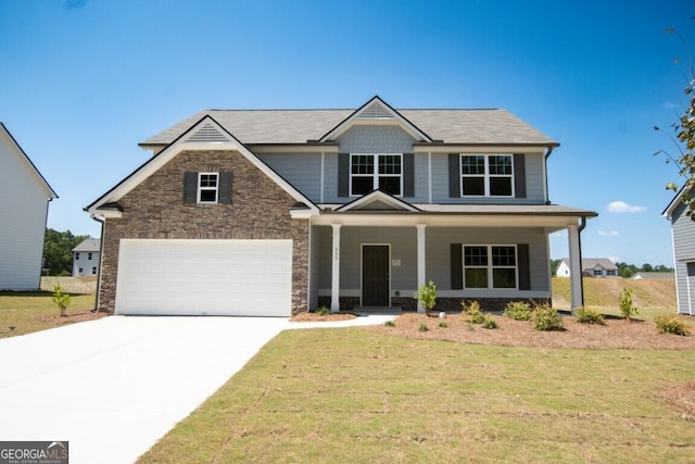 280 River Run Dr Unit 79, Dallas, GA 30132 - craftsman-style house featuring concrete driveway, a front yard, covered porch, an attached garage, and stone siding