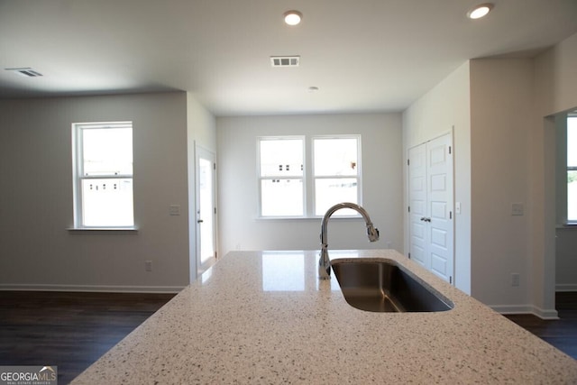 280 River Run Dr Unit 79, Dallas, GA 30132 - kitchen featuring a sink, light stone countertops, recessed lighting, baseboards, and dark wood-style floors